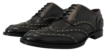 Scarpe derby borchiate in pelle nera