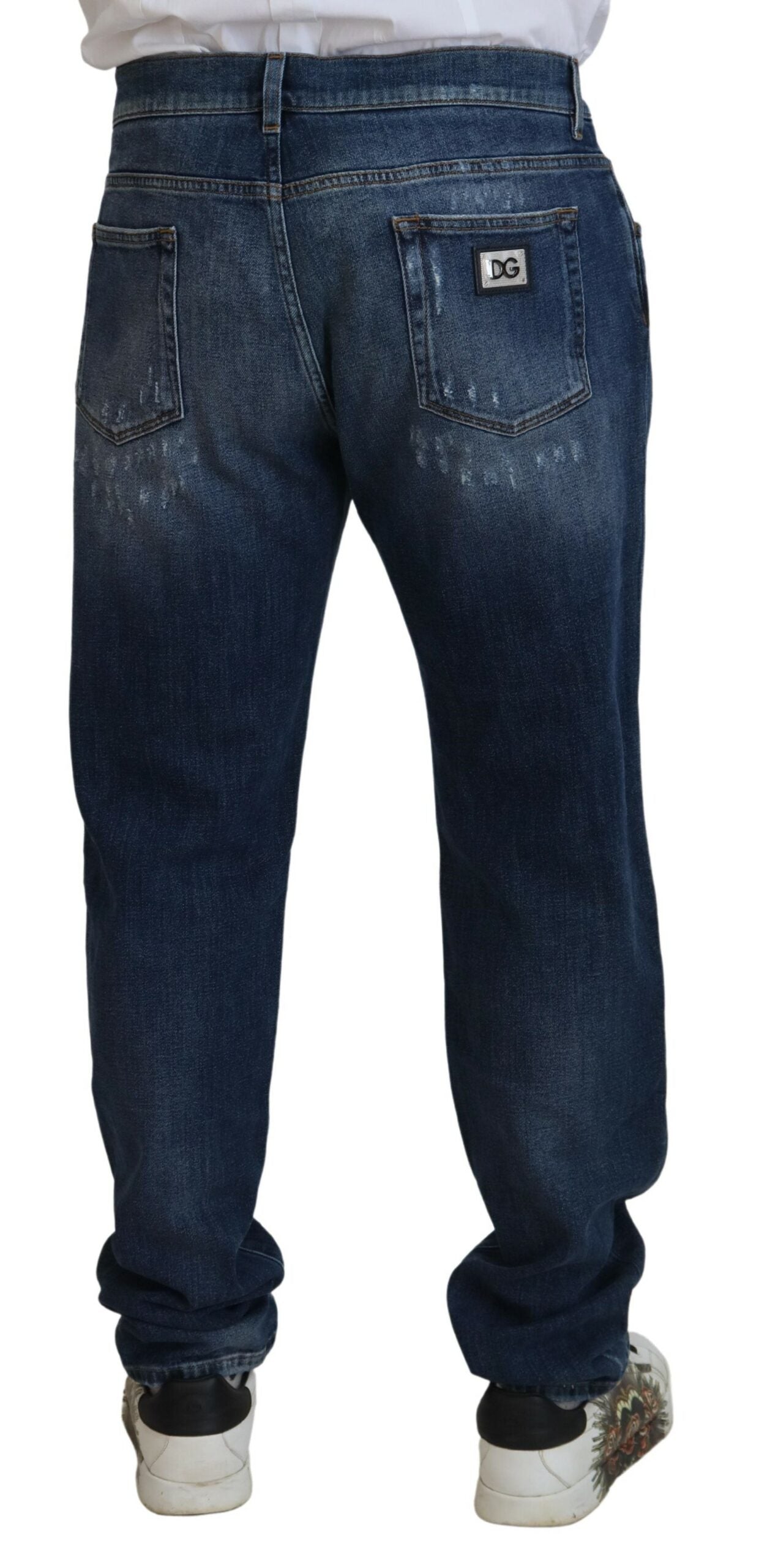 Jeans slim in denim stretch di cotone blu stracciato