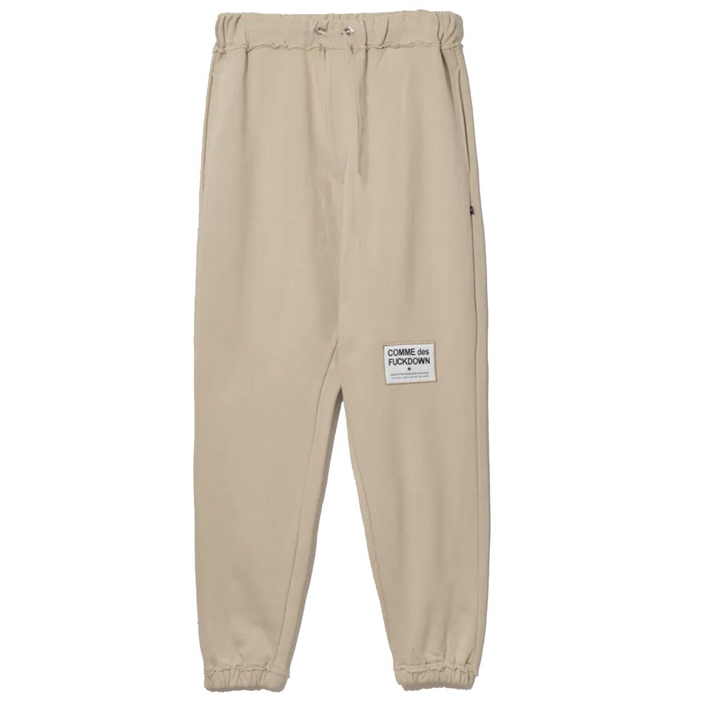 Comme Des Fuckdown – Schicke Jogginghose aus Baumwolle in Beige mit ausgefransten Details